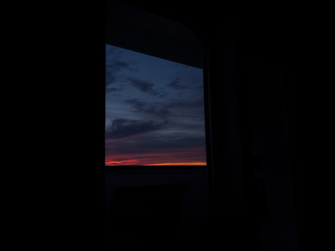 a window with a view of a sunset