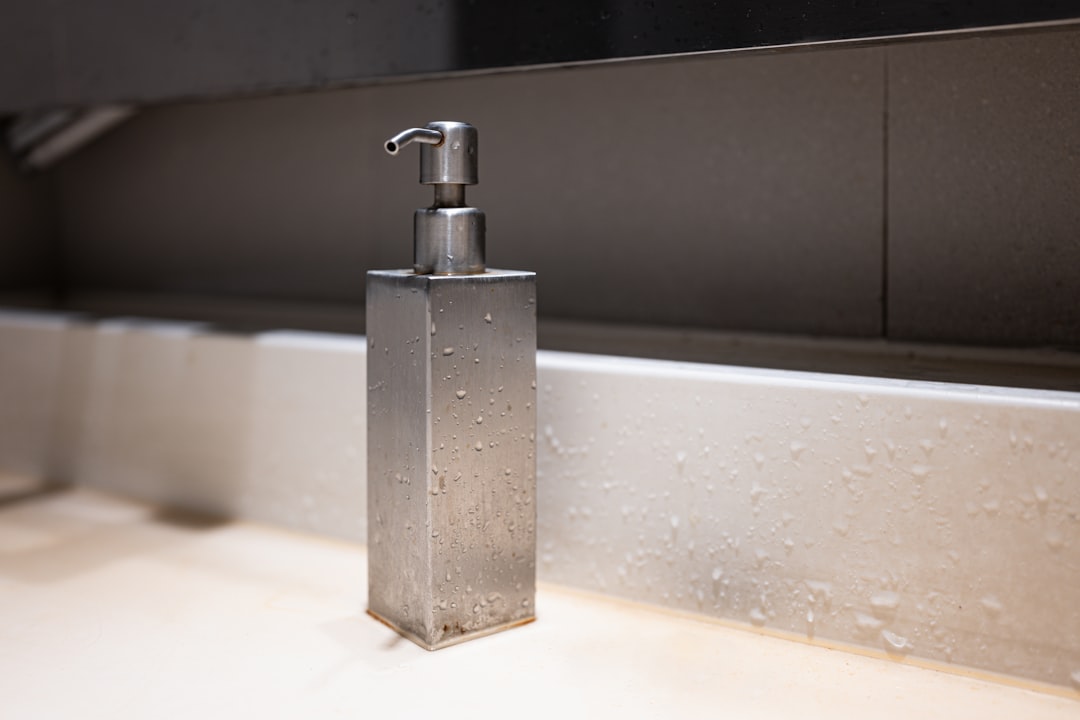 a soap dispenser sitting on top of a counter