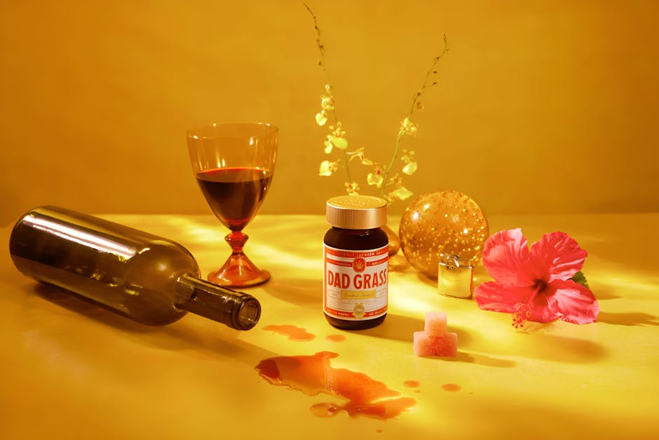 Aesthetic composition with wine, flower, and supplement bottle on a yellow background.
