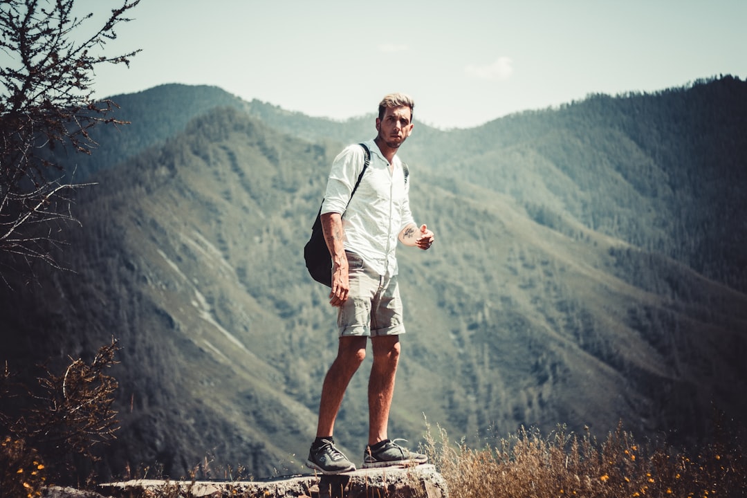 close-up photography of man standing stone